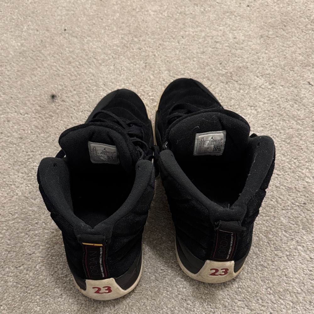 Black Sneakers with Red Accents